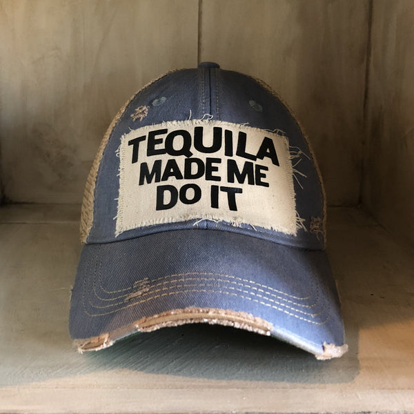 Tequila Made Me Do It hat by BohoGroove featuring bold black Tequila Made Me Do It lettering on a distressed off-white patch on a light blue vintage distressed snapback trucker hat.