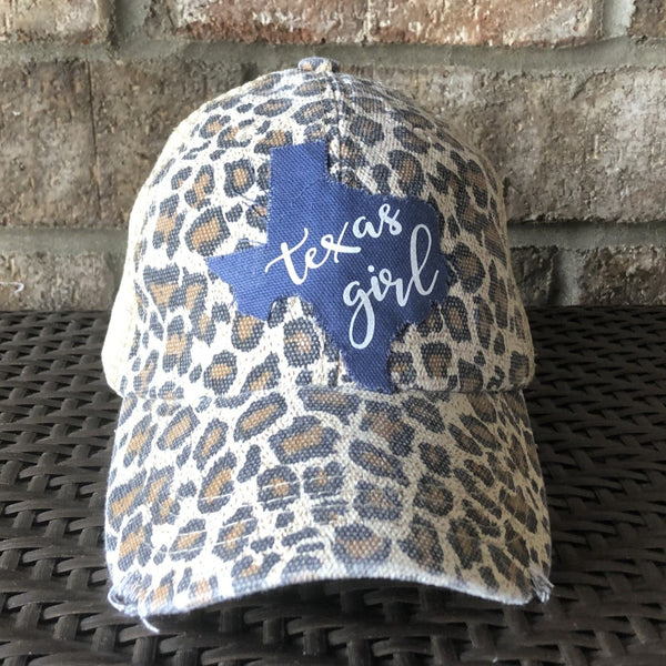 Texas Girl hat by BohoGroove with white Texas Girl lettering on blue Texas-shaped patch and leopard vintage distressed snapback