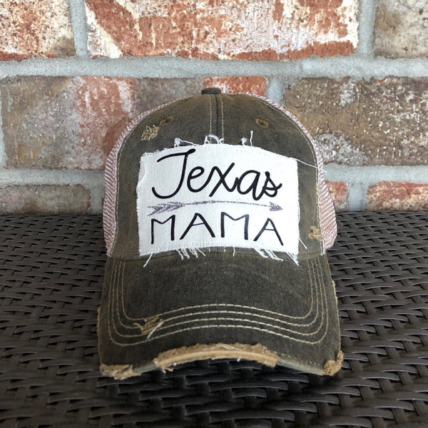 Texas Mama hat by BohoGroove with black Texas Mama lettering and arrow graphic on a distressed off-white patch on a black vintage distressed snapback.