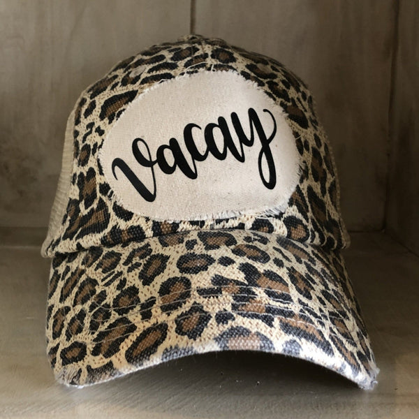 Vacay hat by BohoGroove with black Vacay lettering on distressed off-white patch and leopard vintage distressed snapback