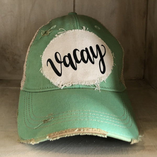 Vacay hat by BohoGroove with black Vacay lettering on distressed off-white patch and mint vintage distressed snapback
