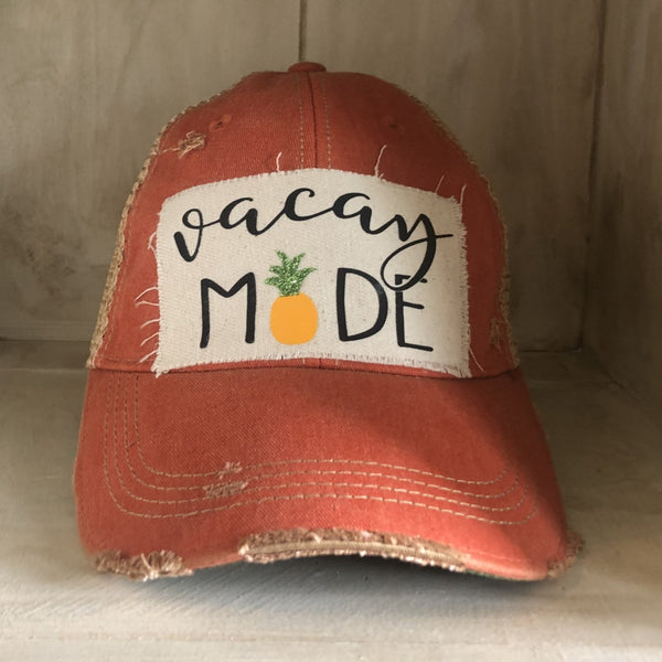 Vacay Mode hat by BohoGroove with black Vacay Mode lettering and pineapple graphic on distressed off-white patch and orange vintage distressed snapback