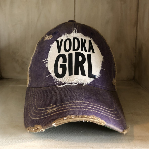 Vodka Girl hat by BohoGroove with black Vodka Girl lettering on a distressed off-white patch on a purple vintage distressed snapback trucker hat.