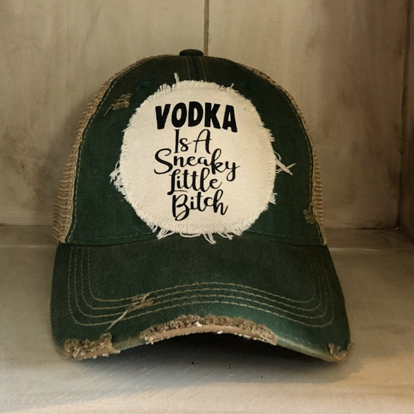 Vodka Is a Sneaky Little Bitch hat by BohoGroove with black lettering on a distressed off-white patch on a green vintage distressed snapback.