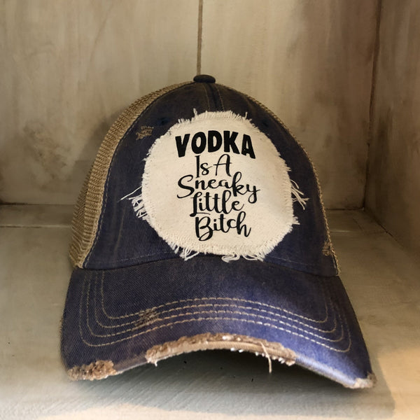 Vodka Is a Sneaky Little Bitch hat by BohoGroove with black lettering on a distressed off-white patch on a royal blue vintage distressed snapback.
