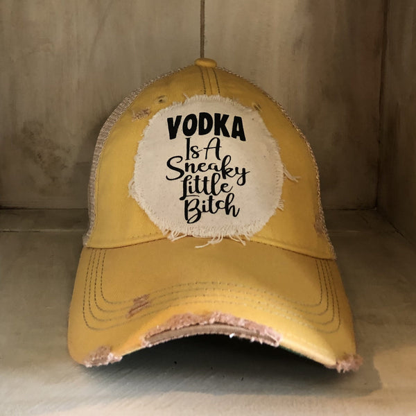 Vodka Is a Sneaky Little Bitch hat by BohoGroove with black lettering on a distressed off-white patch on a yellow vintage distressed snapback.