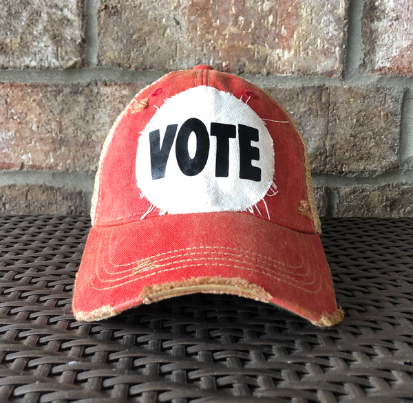 Vote hat by BohoGroove with bold black VOTE lettering on distressed off-white patch and [color] vintage distressed snapback