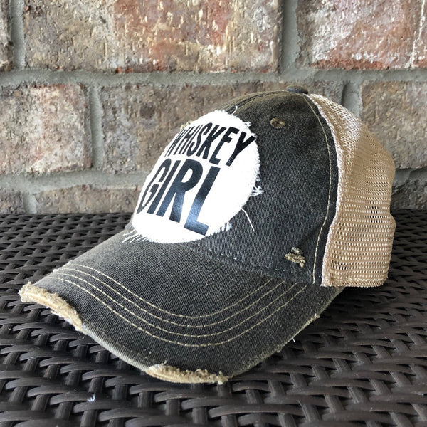 Right side view of Whiskey Girl hat by BohoGroove with black lettering on a distressed off-white patch on a black vintage distressed snapback.