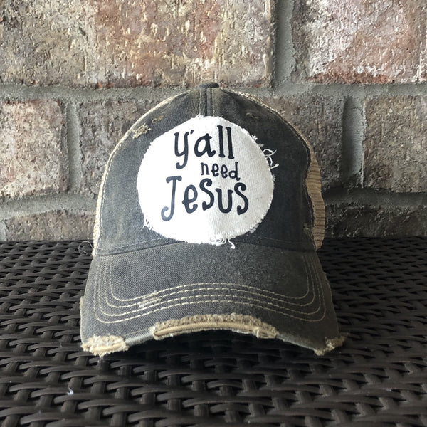 Y’all Need Jesus Hat by BohoGroove with black Y’all Need Jesus lettering on distressed off-white patch on a black vintage distressed snapback