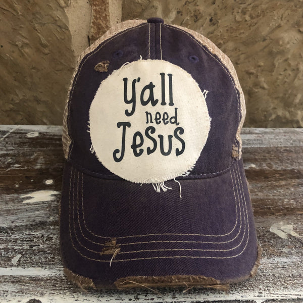 Y’all Need Jesus Hat by BohoGroove with black Y’all Need Jesus lettering on distressed off-white patch on a purple vintage distressed snapback